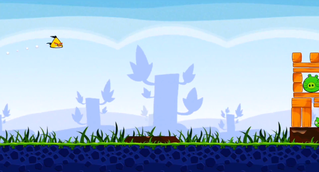 A bird flying towards the pigs' tower in Angry Birds